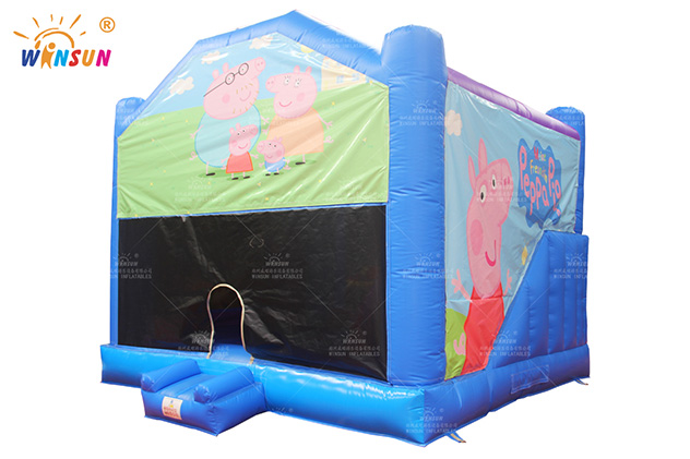 Blue inflatable moonwalk for sale in the UK - side view